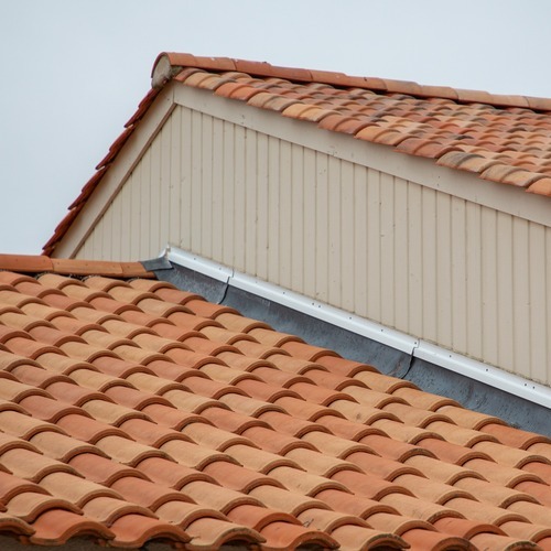 metal flashing strip along the side of a roof